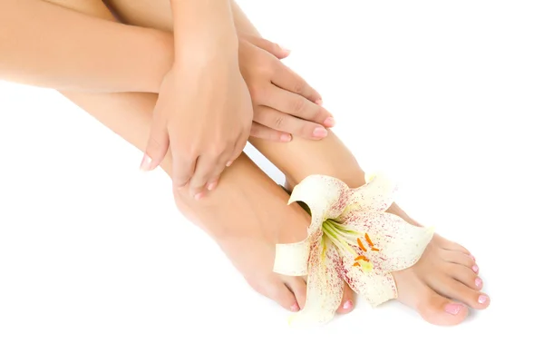 Woman foot with lily flower — Stock Photo, Image
