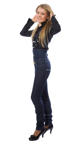 Beauty girl dressed in dark blue jeans — Stock Photo, Image