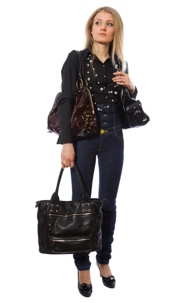 Красавица с тремя сумочками — стоковое фото