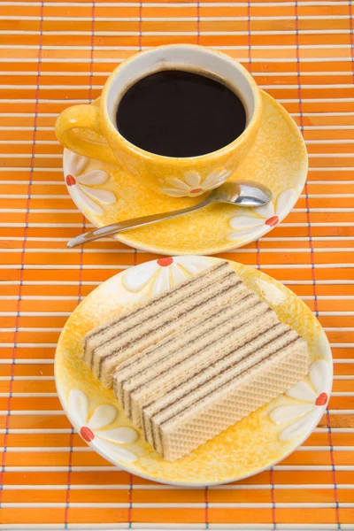 Waffle slice and cup with coffee — Stock Photo, Image