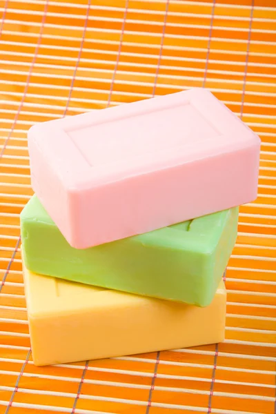 Soap on the bamboo table-cloth — Stock Photo, Image