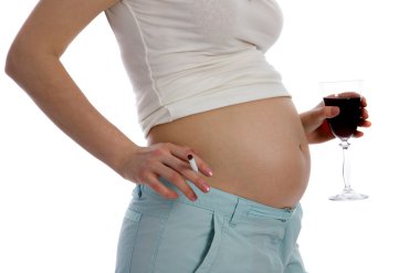 Pregnant woman holding wine clipart