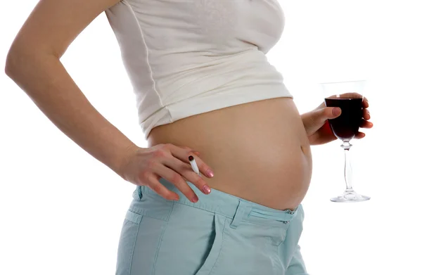 Беременная женщина с вином — стоковое фото