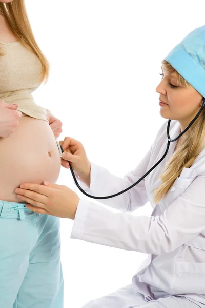 Läkaren undersöker gravid kvinna — Stockfoto