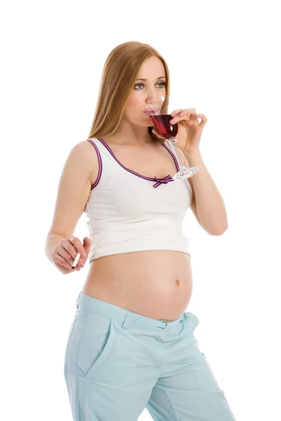 Těhotná žena pít víno — Stock fotografie
