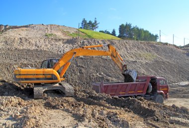 Backhoe loader loading dumper clipart