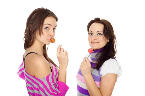 Attractive girls with lollipops — Stock Photo, Image
