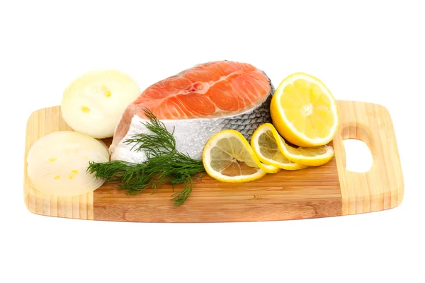 Salmon steak, lemon and onions — Stock Photo, Image