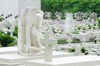 Grieving angel on the military cemetery clipart