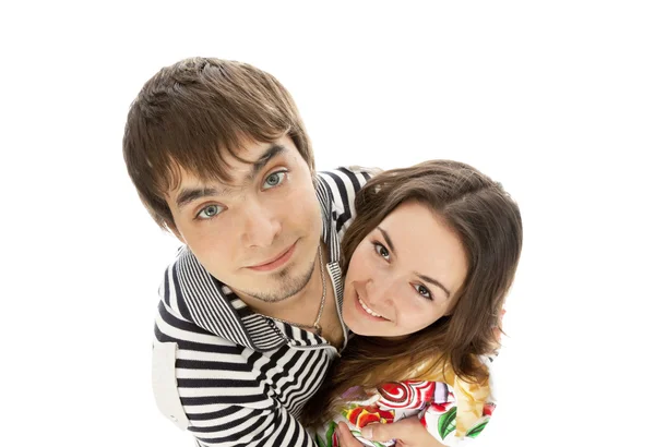 微笑对年轻夫妇在白色上隔绝的爱 — 图库照片