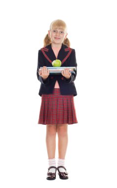 Girl in school uniform holding a stack of books and bite the apple