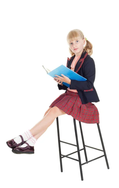 stock image Teen girl in school uniform reading a book