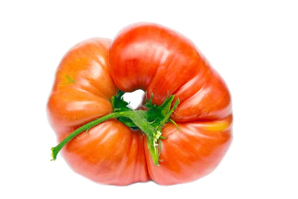 Große reife Tomate mit einem Loch in der Mitte. isoliert auf weißem Bac — Stockfoto