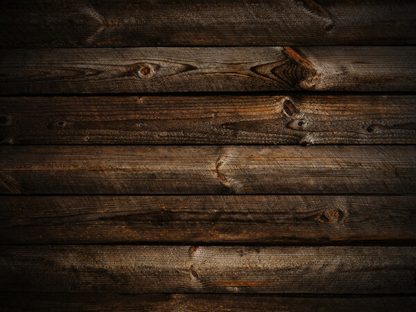 Photo of horizontal abstract dark wooden background with light