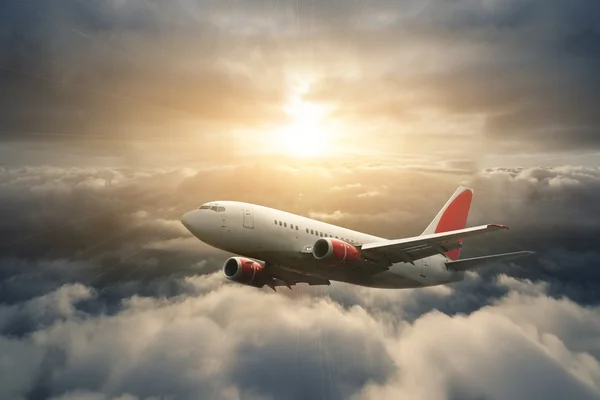 Letadlo na obloze při západu slunce — Stock fotografie