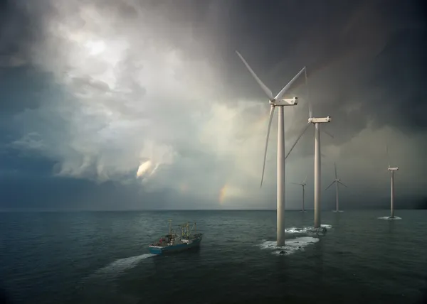 stock image Windmill in ocean. Storm rising