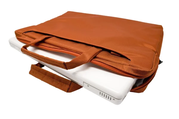 オレンジ色の袋、白いラップトップ — ストック写真