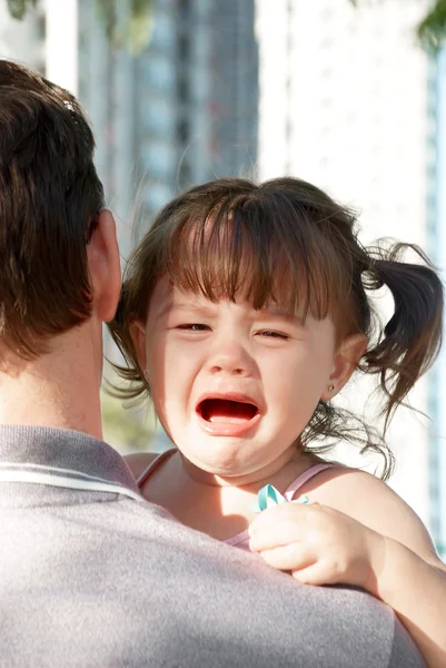 Crying on father's shoulder Stock Image