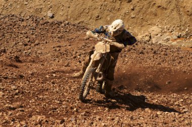 Enduro motocycle climbing a slope clipart