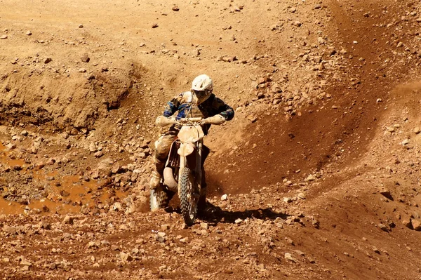 Enduro motocycle climbing a slope — Stock Photo, Image