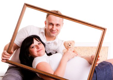 Beautiful young couple waiting to a baby clipart