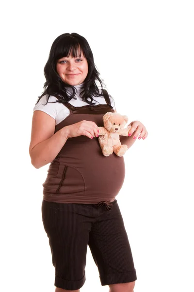 Беременная женщина с игрушкой — стоковое фото