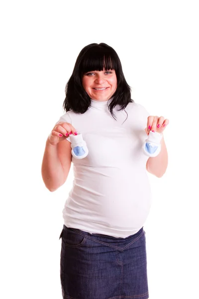 Mujer embarazada con bootee de bebé —  Fotos de Stock