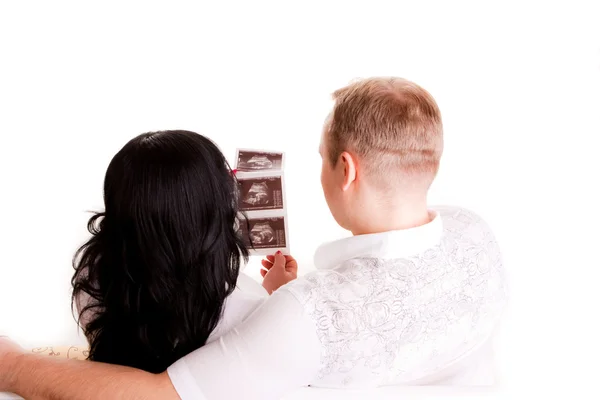 Couple looking at ultrasound picture — Stock Photo, Image