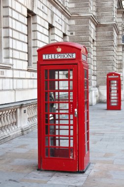 Red telephone booth in London clipart