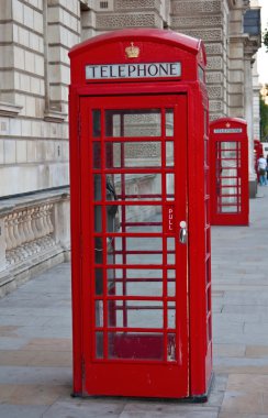 Red telephone booth in London clipart