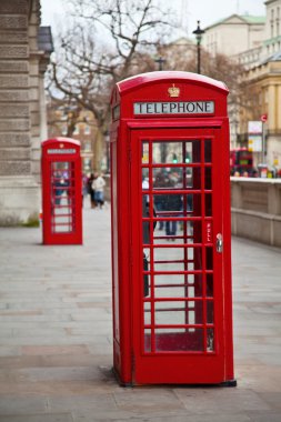 Red telephone booth in London clipart