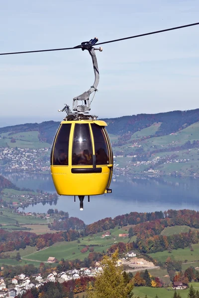 stock image Cable car over alpine lake