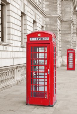 Red telephone booth in London clipart