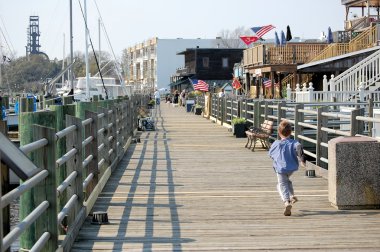 Boy Running Down Dock clipart