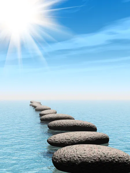 Una fila di pietre in acqua con raggio di sole — Foto Stock