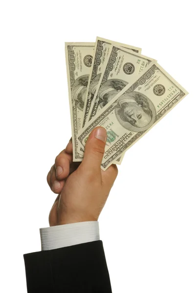 Доллары в руке бизнесмена — стоковое фото