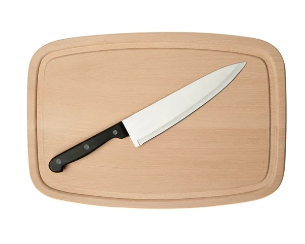 Нож и доска для резки пищи — стоковое фото