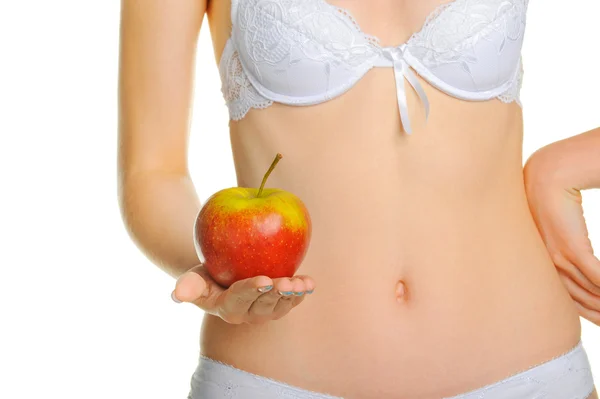 Kvinna välväxt en kropp och ett rött äpple — Stockfoto