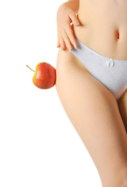 Weibchen formen einen Körper und einen roten Apfel — Stockfoto