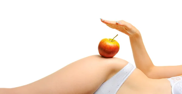 Kvinna välväxt en kropp och ett rött äpple — Stockfoto