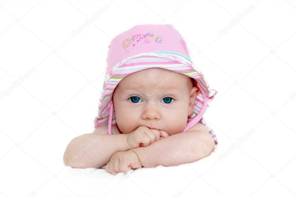 Baby with pink hat and blue eyes