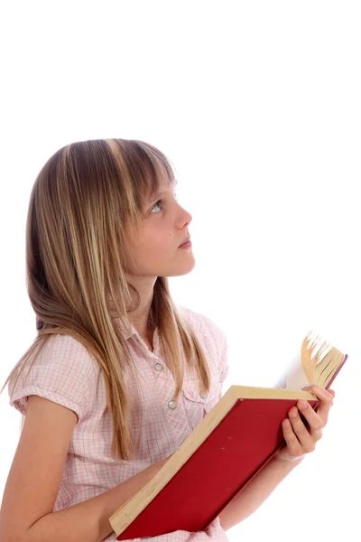 Uma menina loira pensativa com um livro vermelho — Fotografia de Stock