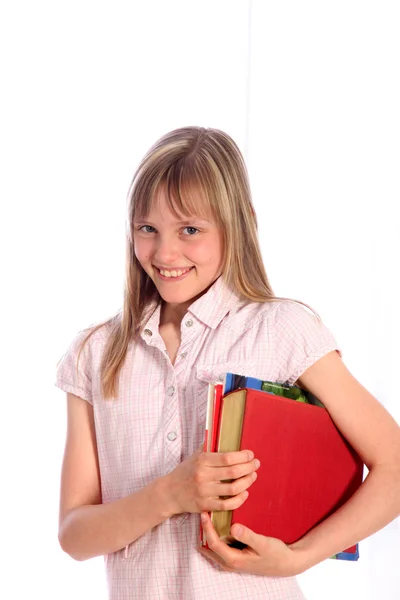 Chica sonriente con libros bajo su brazo —  Fotos de Stock