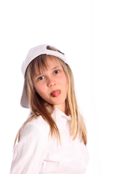 Mladá dívka táhne jazyk — Stock fotografie