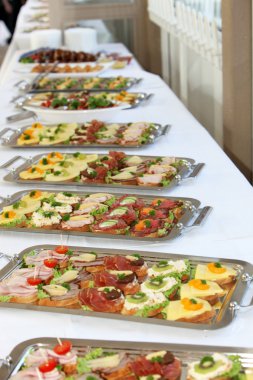 Buffet with appetizers or finger food clipart