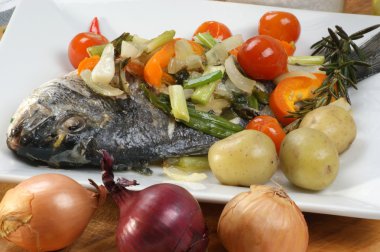 Sea bream from greece with vegetable clipart