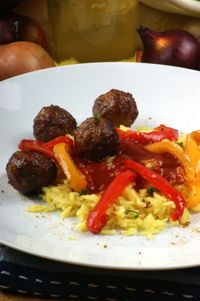 Meatballs with organic curryrice — Stock Photo, Image