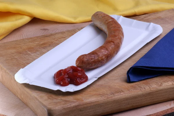 Ham sausage with ketchup — Stock Photo, Image