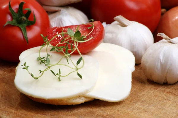 Organic mozzarella cheese on bread — Stock Photo, Image