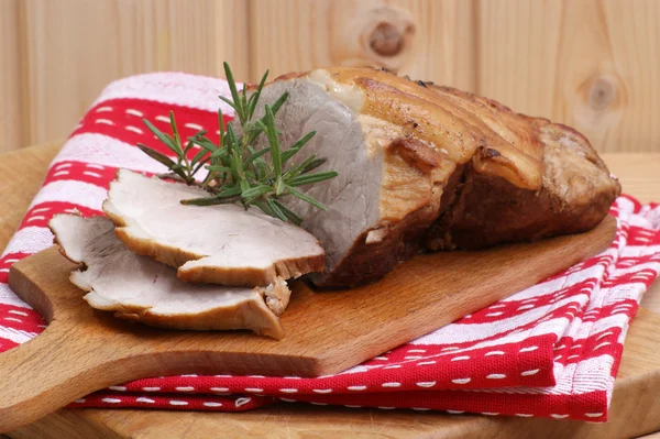 Some roast pork and rosemary — Stock Photo, Image